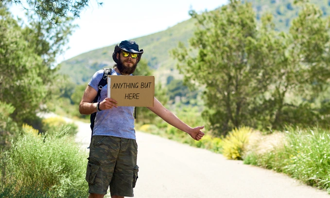 Cardboard sign- how to hitchhike safely in India